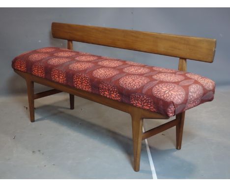 A mid 20th century teak hall bench, with back rest and upholstered padded seat, possibly by A.Younger 