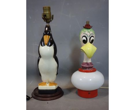 A vintage ceramic lamp in the form of a penguin together with a vintage ceramic bird head lamp 