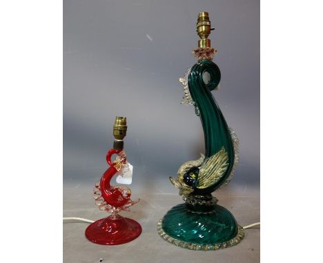 A 20th century Murano green glass dolphin lamp, together with a smaller red example 
