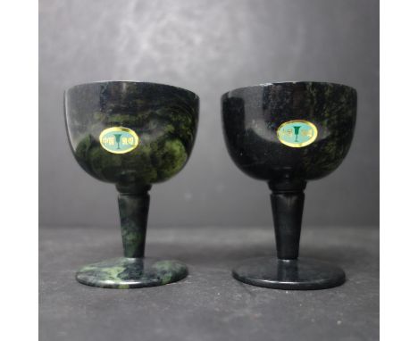 A Pair of 20th century Chinese spinach green Jade Cups, each signed to base, H.8cm, in box 