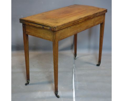 A Georgian inlaid mahogany card table, raised on tapered legs and castors, H.72 W.91 D.44cm 