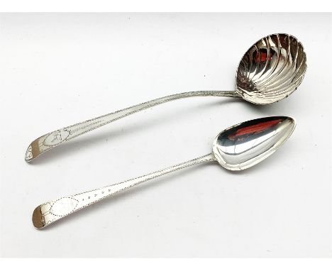 George III Irish silver ladle with bright cut stem and scalloped bowl by James Keating, Dublin and a basting spoon engraved t