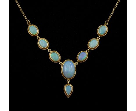 9ct gold oval opal necklace, seven gold mounted cabochon oval opals, with a pendant pear shaped opal, hallmarked 