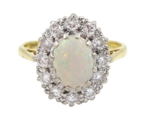 18ct gold oval opal and diamond cluster ring, hallmarked