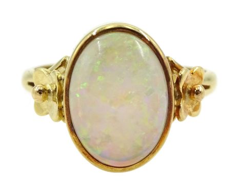 Gold single stone opal ring, with flower decoration wither side, stamped 18ct