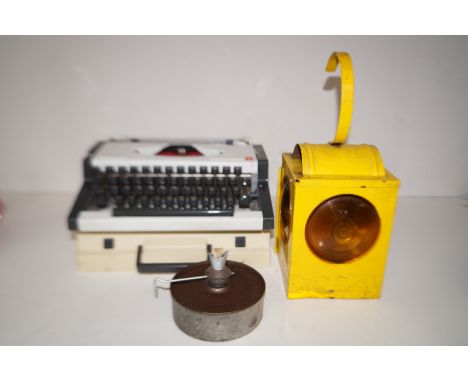 Olympia typewriter together with a vintage road lamp with internal burner 