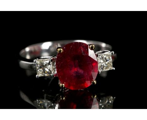 An 18ct white gold, 3 stone ruby and diamond ring.
Ruby weight: 1.99cts.
Total diamond weight: 0.30cts.
Size: K&frac12;.