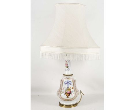 A late 19th century, French Empire style, porcelain lamp base, painted with girl and flowers, enriched with gilt. Sold with m
