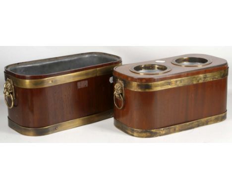 A pair of Georgian style mahogany and brass band wine coolers, one being fitted for 2 bottles. (2).