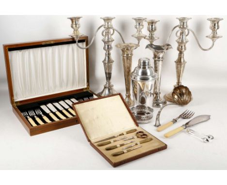 A selection of good silver plated items to include a pair of candelabra, a cocktail shaker, soup ladle, wine coaster, spill v