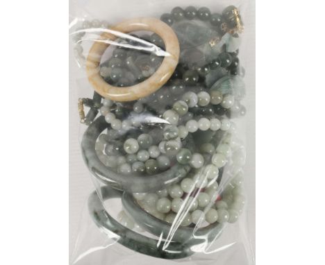 A collection of jade and green hardstone jewellery, including necklaces, bracelets, earrings, pendants etc.