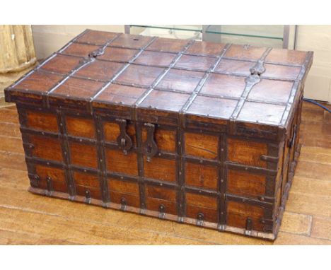 An 18th / 19th century trunk, lattice banding, oak panel body, loop handles, double eye lock. 105cm wide.
