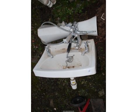 A Twyfords pedestal hand basin plus a bath mixer tap and shower head.