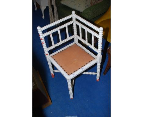 A painted bobbin turned corner chair.