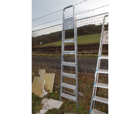 A seven rung aluminium step ladder.