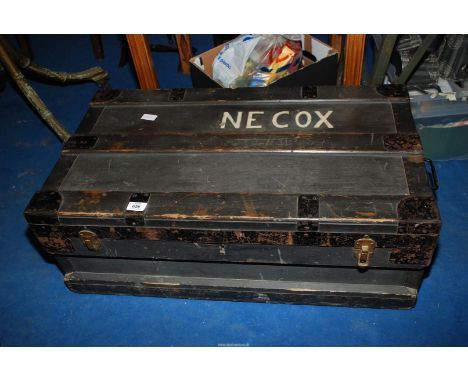 A trunk 'The Marshall Improved Air and Water Tight Chest 1917-1933' stamped 'N.E. Cox'.