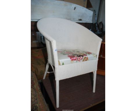 A Lloyd Loom style commode.