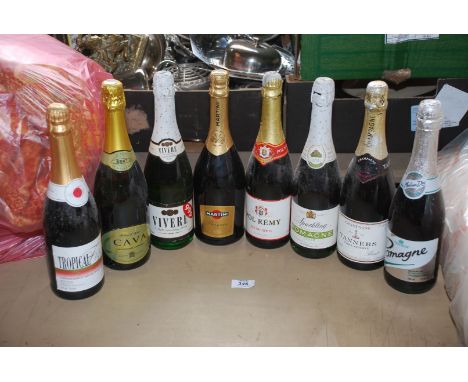 Eight bottles of drinks to include Tanners Extra Reserve Champagne, Spanish Cava, Martini, Prosecco and Perry.