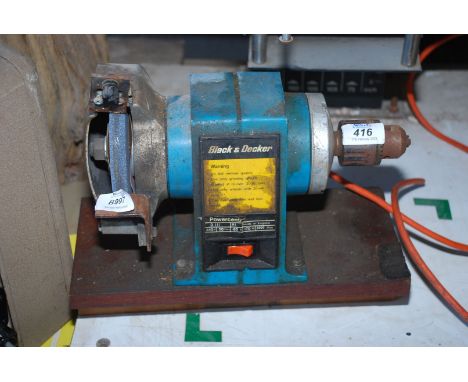 A Black &amp; Decker bench grinder with end chuck.