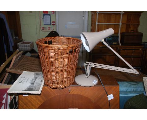 An adjustable lamp and wicker bin etc.
