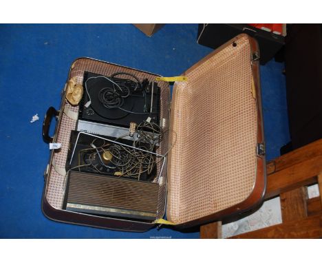 A suitcase with record player and speakers.