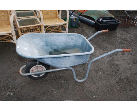 A plastic Hopper wheelbarrow with pneumatic tyre.