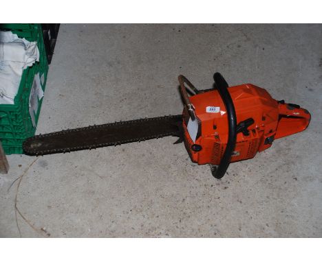 A Husqvarna chainsaw with chain break (sold as seen).