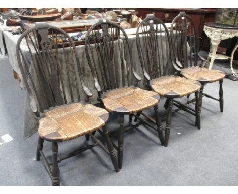 Four stick back dining chairs on rush seats.  