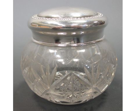 A modern silver wine coaster, London 1973, together with a silver lidded cut glass jar, the lid marked 'sterling'  