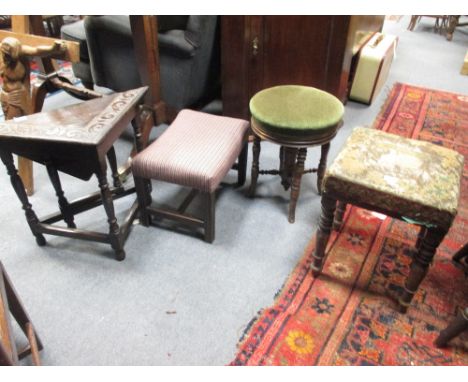 A Victorian mahogany piano stool together with two other stools and an occasional table (4)  