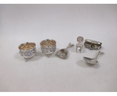 A silver sovereign case, a pair of salts, miniature chair, caddy and sugar spoons  