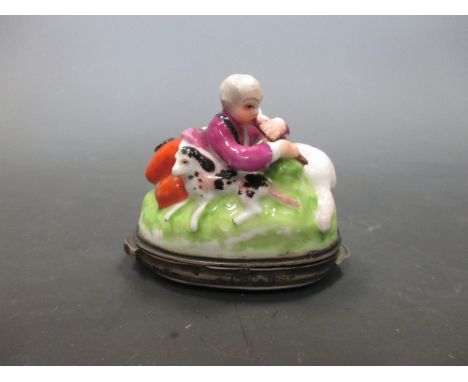 A white metal mounted German porcelain snuff box  