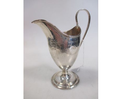 A George III silver helmet shaped cream jug  
