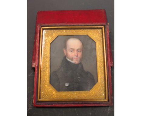 English School (late 19th/early 20th Century) - Portrait miniature of a bearded Gentleman in a black jacket and stock with a 