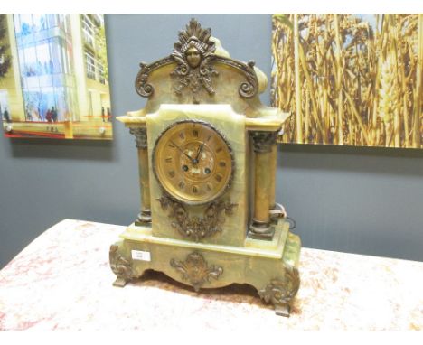 A green onyx and gilt mantle clock  