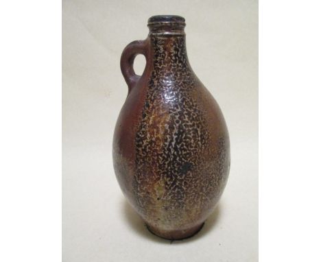 An English brown salt glaze flagon of Bellarmine type, possibly 17th century, 31cm high; a Renaissance maiolica tile, a two h