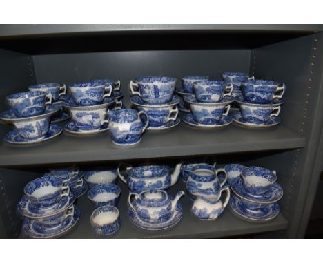 Two shelves of Copeland Spode Italian pattern tea wares including tea pot, milk jugs, sugar bowls and tea cup and saucers set