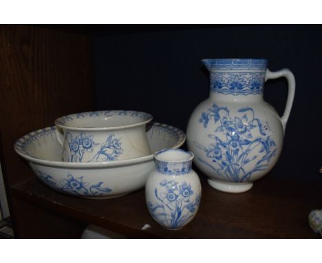 A Royal Doulton 'Daffodill' pattern four-piece toilet set, comprising wash jug, basin, chamber pot and holder, all transfer p