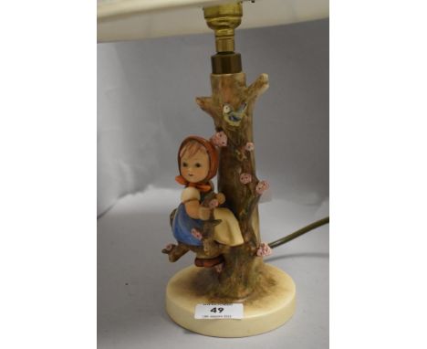 A vintage Geobel Hummel table lamp of a girl sat in an apple tree in good condition