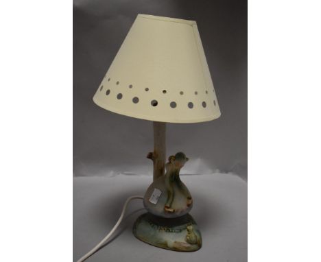 A mid century Denby Bourne table lamp possibly signed by David Yorath, with a Pixie sat on mushroom looking at a frog. Having