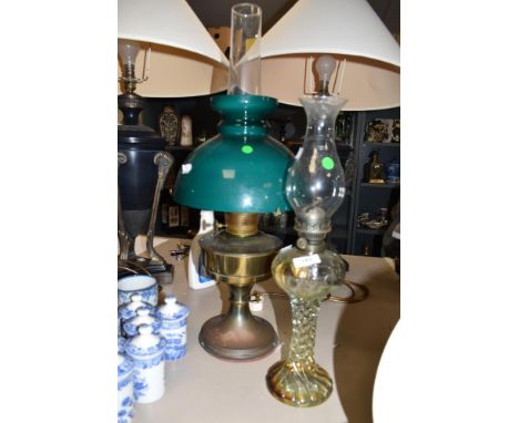An early 20th century moulded glass oil lamp