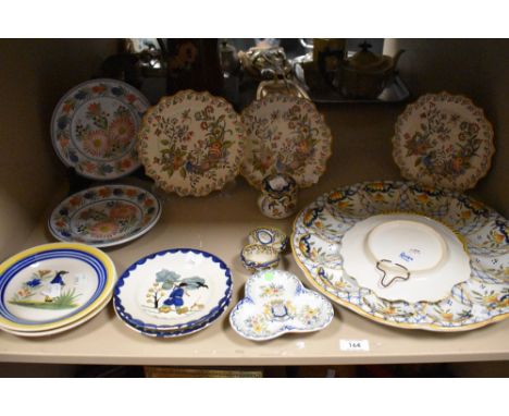 A selection of Continental tin glazed earthernware, including Rouen and Quimper,