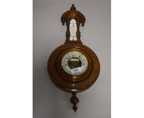 An early 20th century barometer, with opaque glass thermometer scale