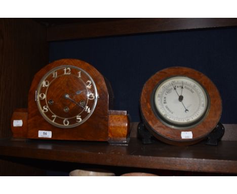 An Edwardian mantel clock having birds eye maple and mahogany case along with a button form oak cased barometer
