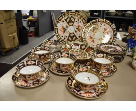 A group of Royal Crown Derby 2451 Imari pattern teawares, including plates, cups and saucers, some with repairs.