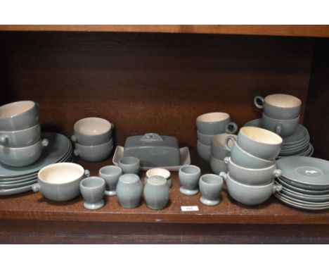 A quantity of green Denby stoneware dinner wares, to include bowls, butter dish and cover, condiments, egg cups, plates, cups