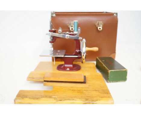 Small cased childs vintage sewing machine 