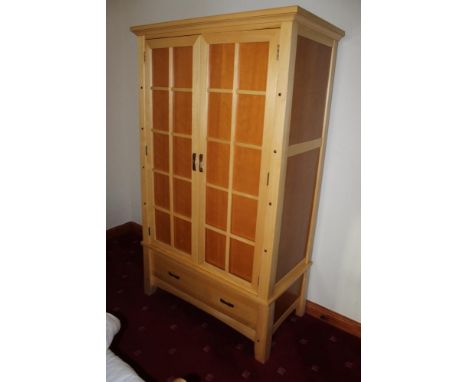 A modern light wood five piece bedroom suite, comprising double bed, wardrobe, chest of 2/4 drawers, and a pair of bedside ch