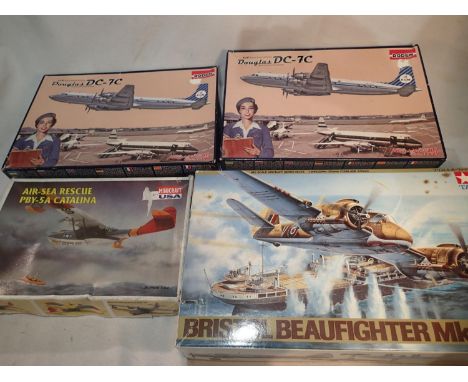 Two Roden 1/144 scale Douglas DC-7C airliner kits, K.L.M Airlines, appears complete, unstarted, plus Tamiya 1/48 scale Beaufi