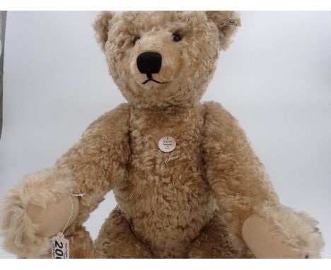 Steiff Bear, 1909 replica, with tag attached, button in ear with off-white label and black text, stitch down nose and jointed